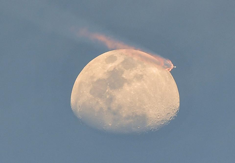 A SpaceX Falcon 9 rocket passes in front of the moon after liftoff from Cape Canaveral Space Force Station, FL Thursday, April 18, 2024. The rocket is carrying 23 Starlink satellites. Craig Bailey/FLORIDA TODAY via USA TODAY NETWORK