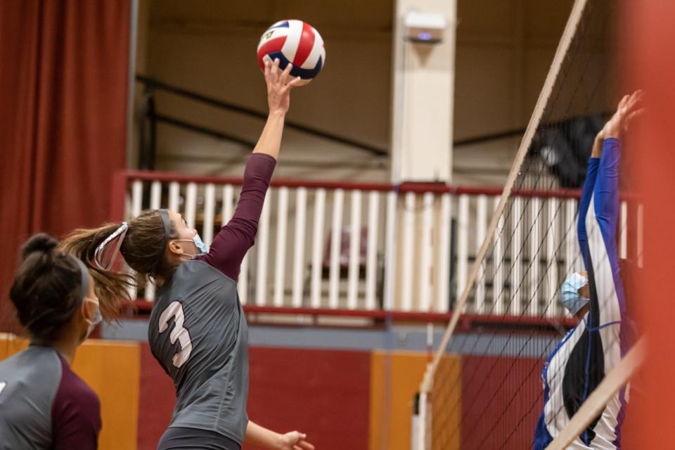 Bishop Stang’s Mae Lima connects with the ball.