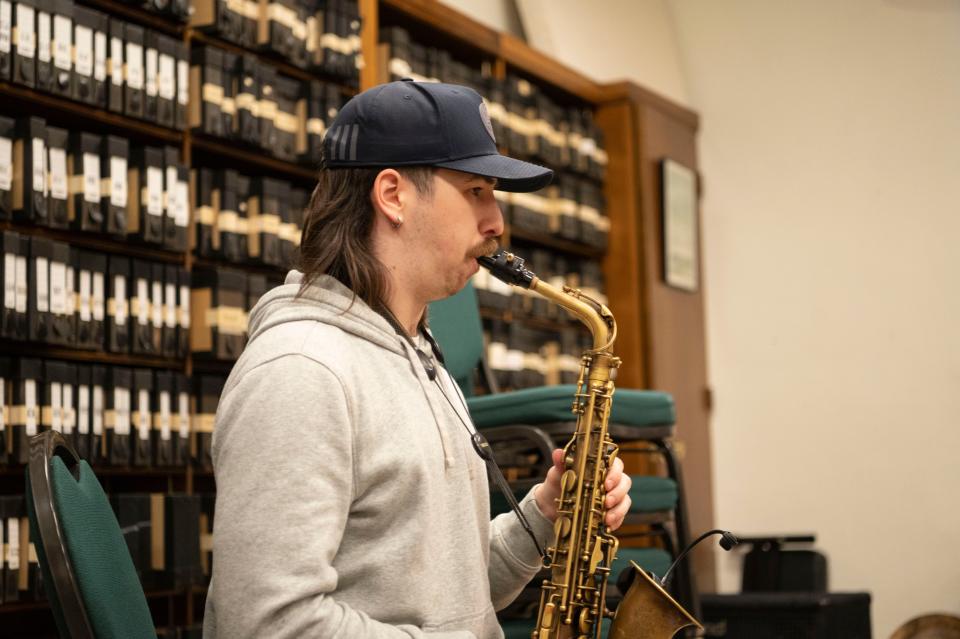 Saxophonist Tommy Pancy rehearses with Minor Element at First Congregational Church in Battle Creek on Tuesday, March 28, 2023.