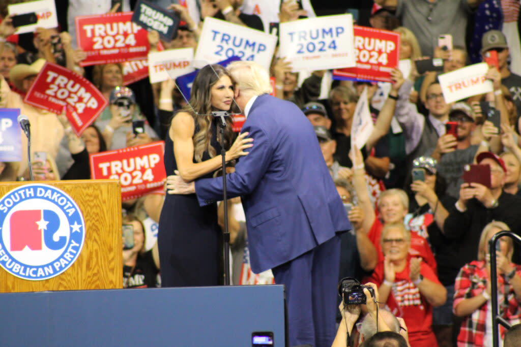 Gov. Kristi Noem greets former President Donald Trump at a rally Sept. 8, 2023, at The Monument in Rapid City. (Seth Tupper/South Dakota Searchlight)