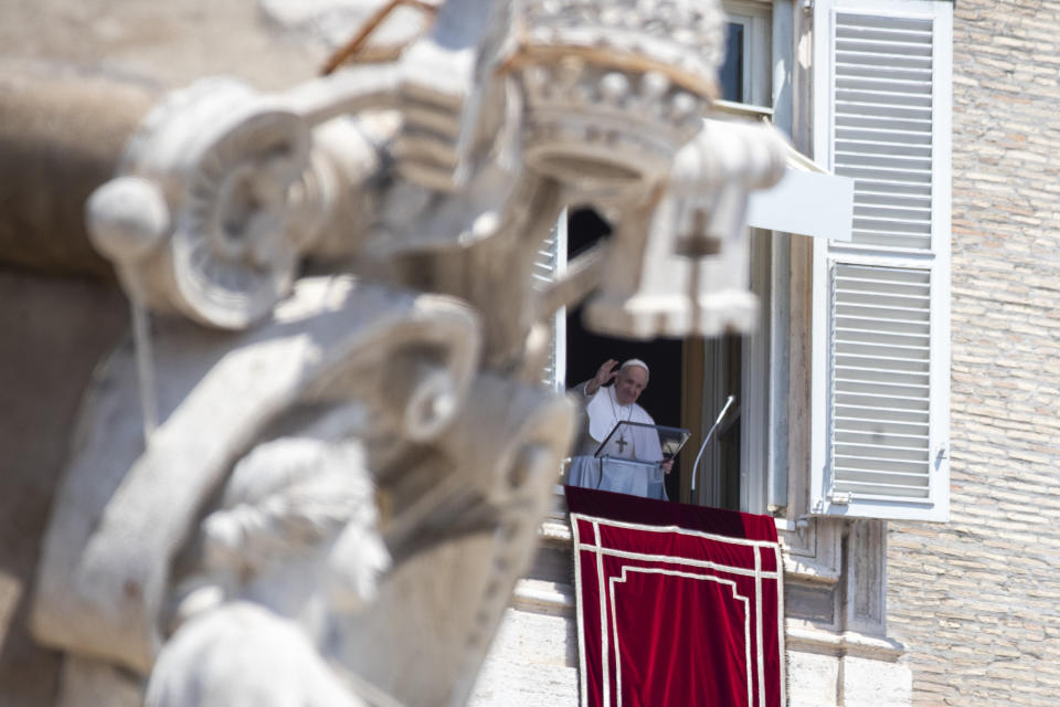 Pope Francis arrives for the Angelus prayer he delivers from the window of his studio overlooking St. Peter's Square at the Vatican, Sunday, July 12, 2020. (AP Photo/Alessandra Tarantino)