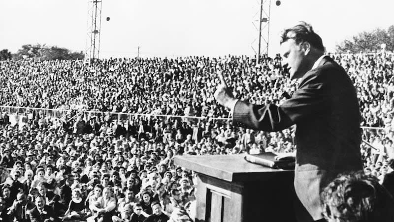 Evangelist Billy Graham, who started his preaching career on a Tampa street corner and practiced in front of Cyprus tree stumps, talks to a crowd of more than 20,000 on Feb. 5, 1961. A statue of one of America’s most powerful preachers was unveiled in Washington, D.C., May 16.