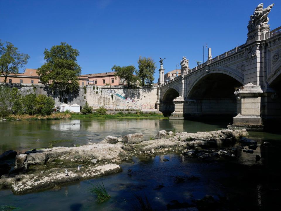 The ruins of the ancient Roman Neronian bridge, emerge from the river bed of the Tiber river, in Rome, Monday, Aug. 22, 2022.