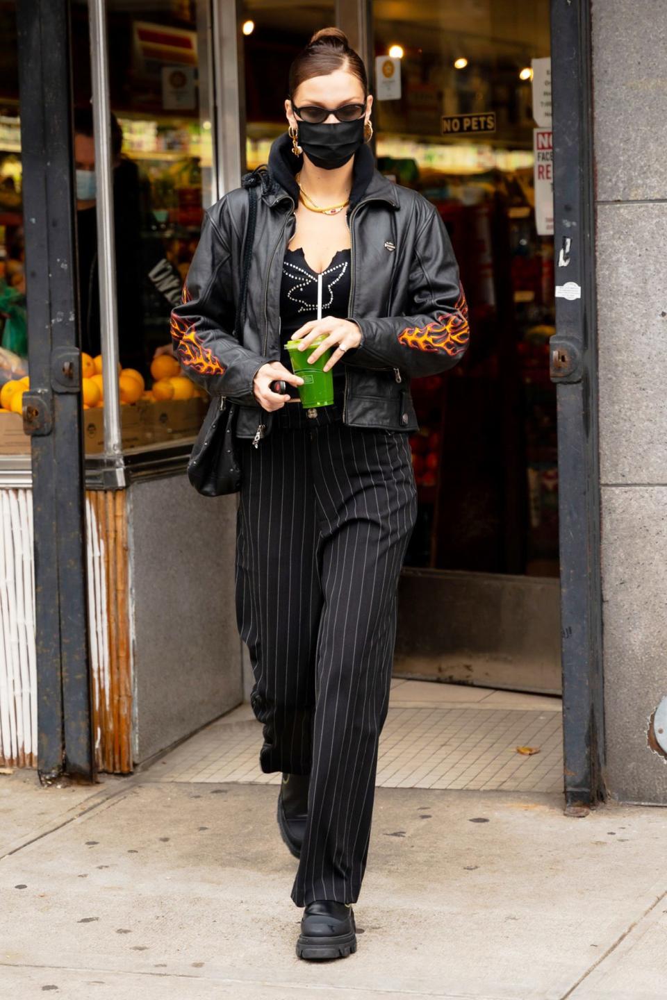 <p>Bella Hadid fuels up with a green juice on Tuesday in N.Y.C. </p>