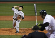 New York Yankees starting pitcher Masahiro Tanaka delivers to Boston Red Sox designated hitter David Ortiz during the first inning of a baseball game at Fenway Park in Boston, Tuesday, April 22, 2014. (AP Photo/Elise Amendola)