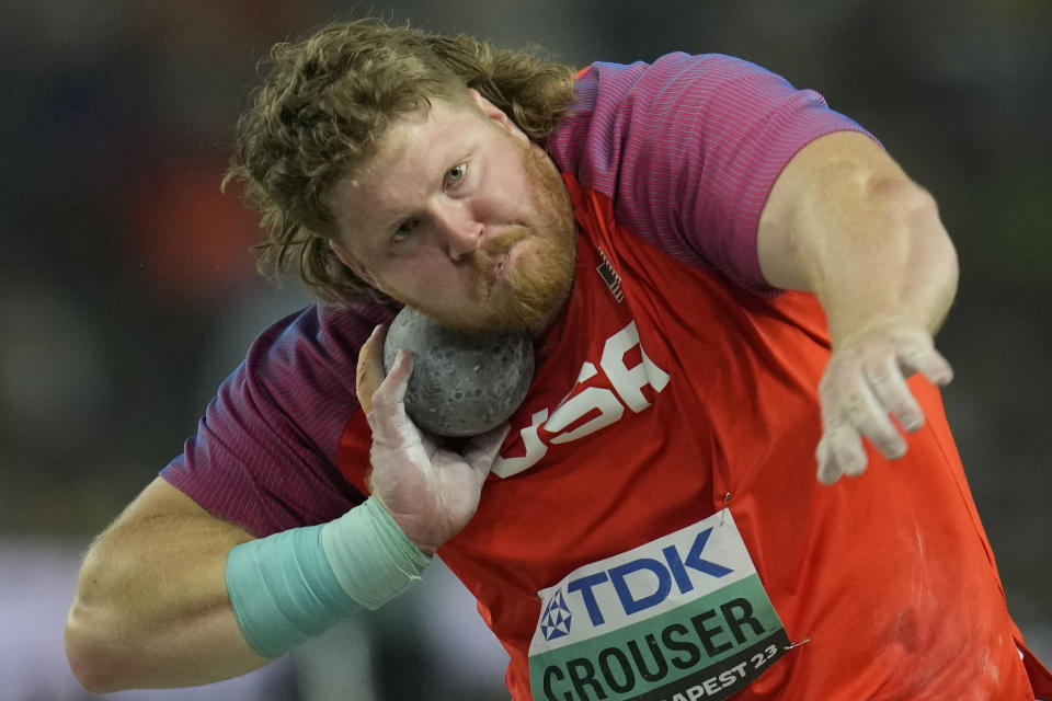 Ryan Crouser, of the United States, prepares to throw as he competes in the Men's-shot put final during the World Athletics Championships in Budapest, Hungary, Saturday, Aug. 19, 2023. (AP Photo/Ashley Landis)