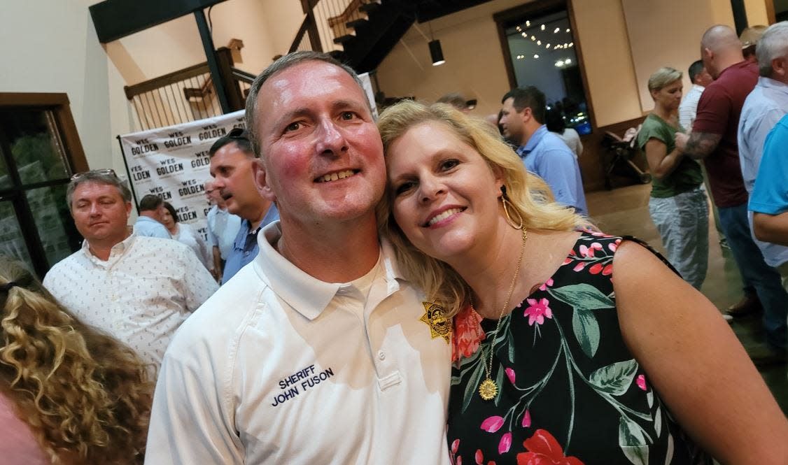 Montgomery County Sheriff John and wife Jennifer Fuson watching voting results come in Thursday. Fuson won reelection as sheriff, a position he has held since 2012.
