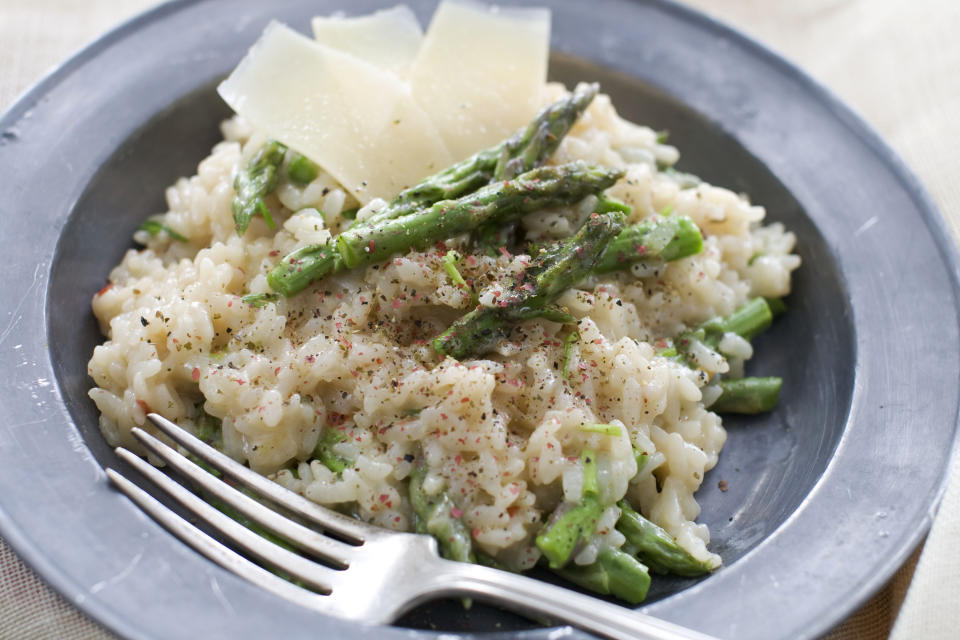 In this image taken on March 11, 2013, pressure cooker risotto with asparagus is shown served on a plate in Concord, N.H. (AP Photo/Matthew Mead)