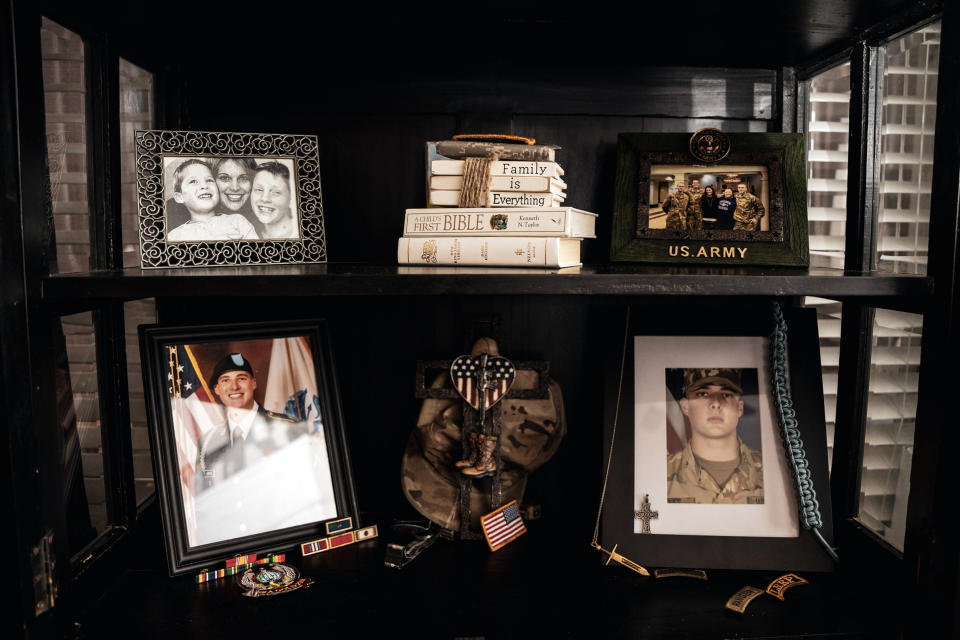 A shelf in Misti Gossett's living room dedicated to her son Joshua Jones, in Hernando, Miss., on Nov. 1, 2022. (Andrea Morales for NBC News)