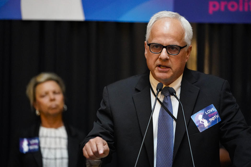 Indiana Right to Life President Mike Fichter speaks at a rally of anti-abortion supporters as the Indiana Senate Rules Committee met to consider a Republican proposal to ban nearly all abortions in the state during a hearing at the Statehouse in Indianapolis, Tuesday, July 26, 2022. (AP Photo/Michael Conroy)