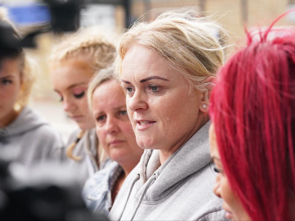 Hollie Dance (second right) outside the hospital after the Supreme Court’s decision (PA)