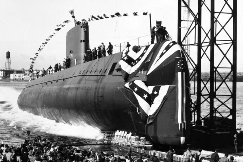 The nuclear-powered submarine USS Nautilus slips into the Thames River in New London, Conn., on January 21, 1954. On March 4, 1958, the Nautilus reached the North Pole by passing beneath the Arctic ice cap. File Photo by U.S. Navy/UPI