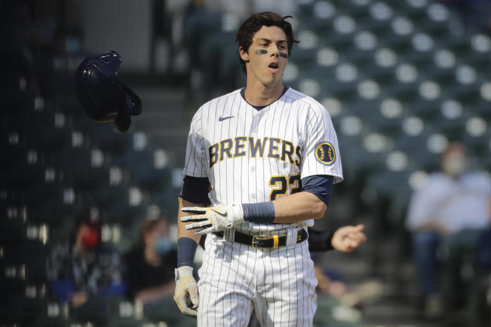 Milwaukee Brewers' Christian Yelich tosses his helmet after striking out during the seventh inning of a baseball game against the Minnesota Twins Sunday, April 4, 2021, in Milwaukee. (AP Photo/Aaron Gash)