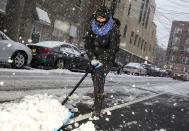 <p>Noemi Napoles helps shovel snow in front of her house in West New York, N.J., March 7, 2018. (Photo: Seth Wenig/AP) </p>