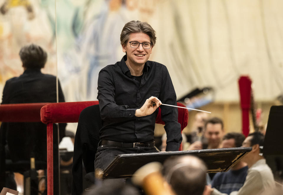 This image released by the Metropolitan Opera shows Daniele Rustioni conducting the Metropolitan Opera Orchestra during a rehearsal on Feb. 9, 2023 in New York. (Jonathan Tichler/Metropolitan Opera via AP)