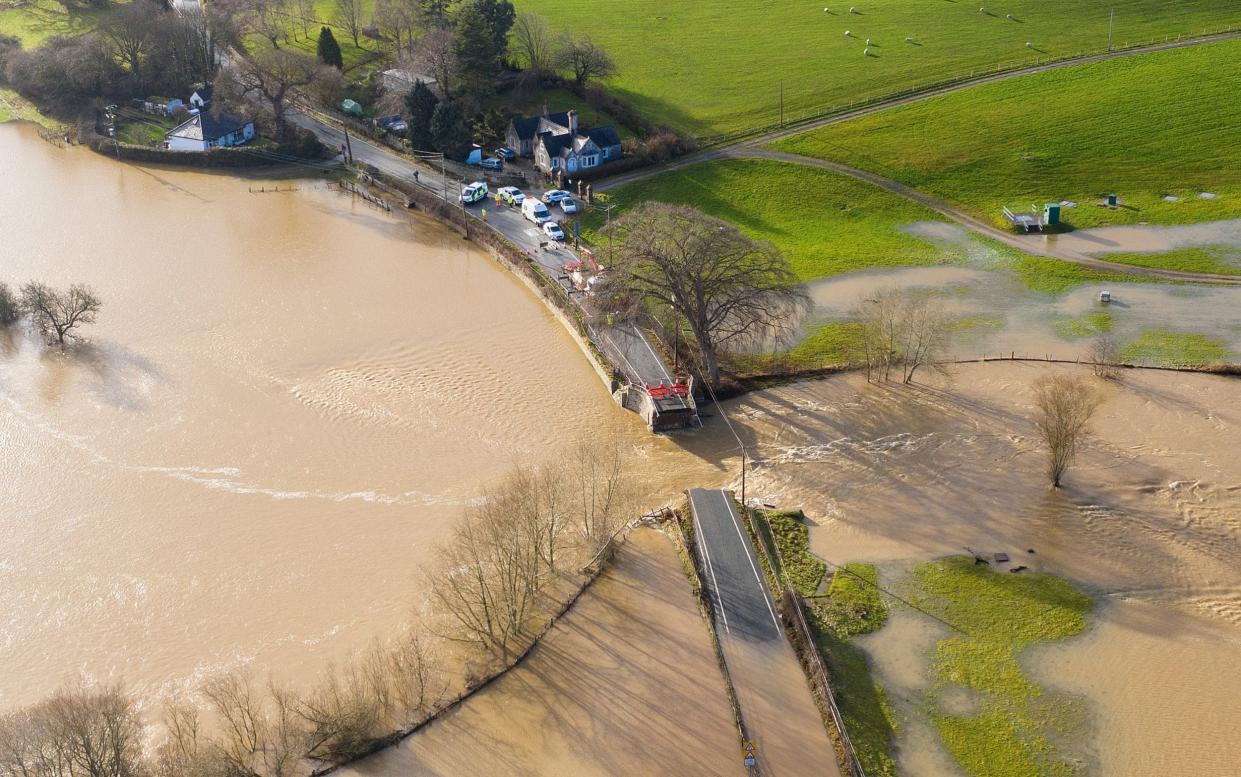 The historic Llanerch Bridge between Trefnant and Tremeirchion collapsed due to the floodwaters -  Getty Images Europe