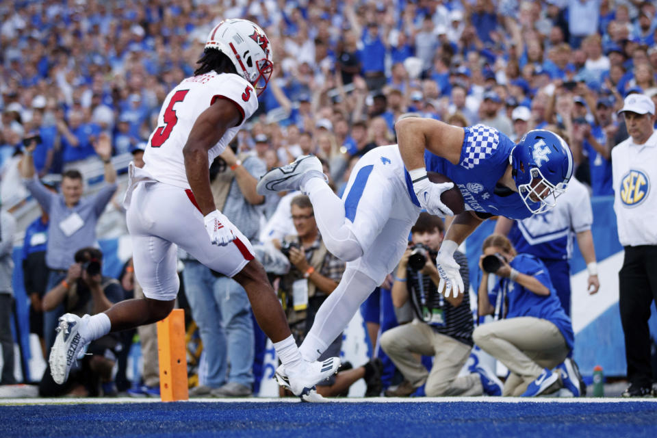 Kentucky tight end Brenden Bates, right, falls into the end zone for a touchdown during the first half of the team's NCAA college football game against Miami (Ohio) in Lexington, Ky., Saturday, Sept. 3, 2022. (AP Photo/Michael Clubb)