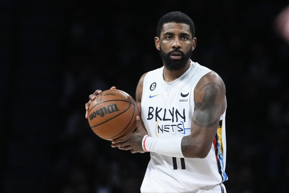 Brooklyn Nets' Kyrie Irving (11) looks to pass the ball during the first half of an NBA basketball game against the Oklahoma City Thunder, Sunday, Jan. 15, 2023 in New York. (AP Photo/Frank Franklin II)