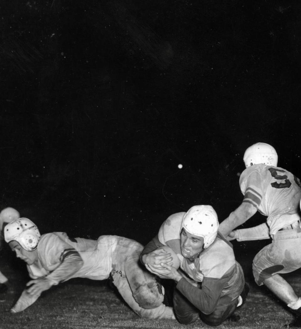 Masonic Home football player Hardy ‘Gordy’ Brown scores against North Side in 1941. Brown went on to shine as an NFL linebacker for eight years