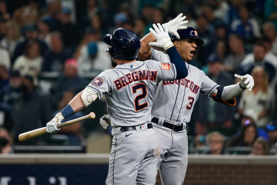 Astros shortstop Jeremy Pena celebrates with third baseman Alex Bregman after a solo home run in the 18th inning in Game 3.