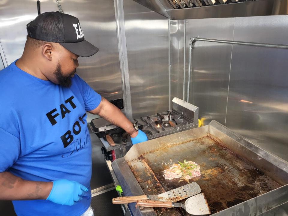 K.J. Townsend cooks up a Fat Boy Philly on his griddle in his new food truck, April 6 in Downtown Houma during Twinfest Louisiana. He has his grand opening Tuesday, April 9 at 10 a.m. outside of Quisine Quarters, 6670 W Main St, Houma.