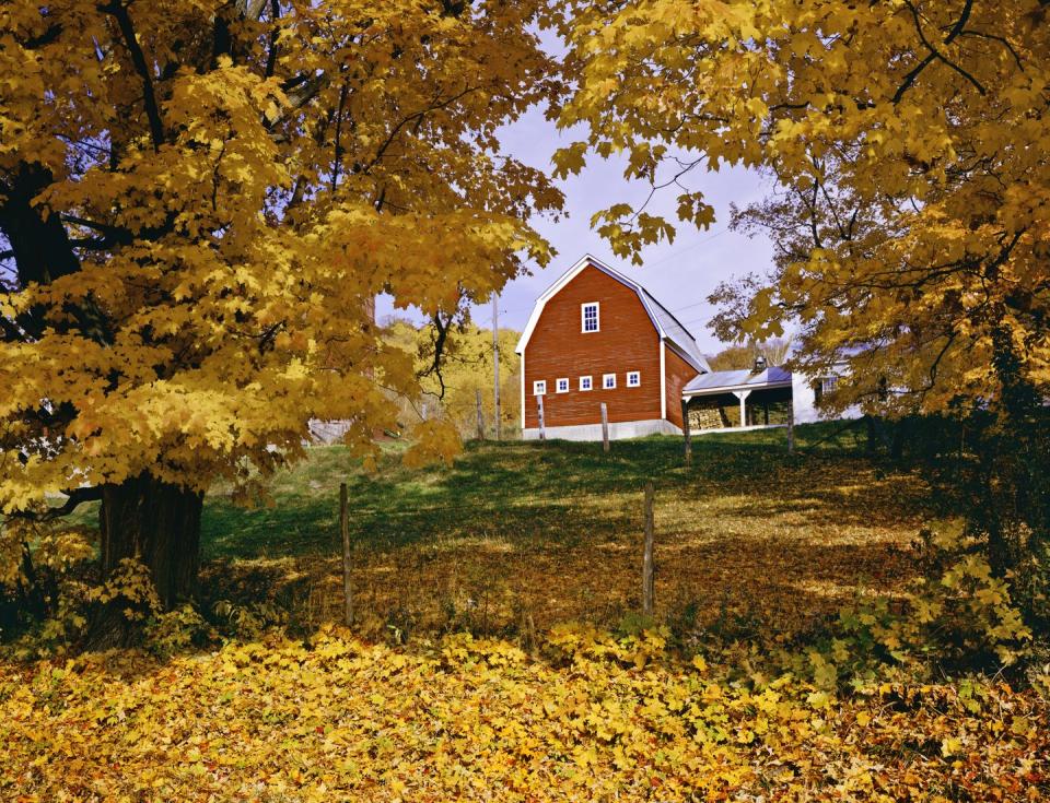 <p>A red barn sits atop a hill in Vermont's Green Mountains.</p>