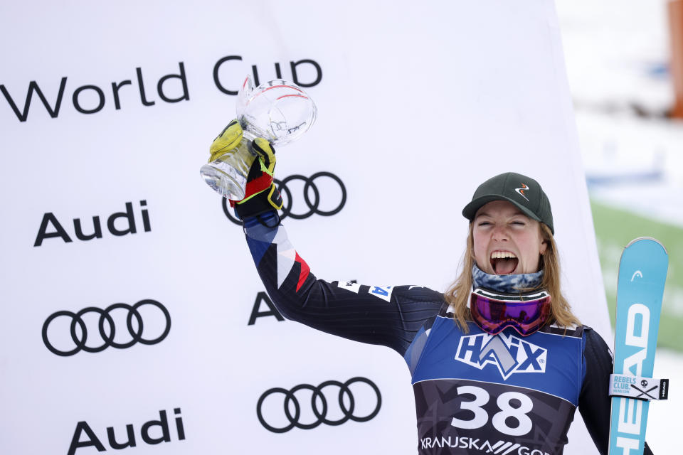 United States' A.J. Hurt celebrates on the podium after taking third place in an alpine ski, women's World Cup slalom race, in Kranjska Gora, Slovenia, Sunday, Jan. 7, 2024. (AP Photo/Giovanni Maria Pizzato)