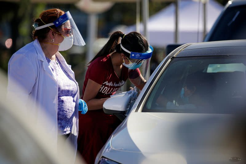 FILE PHOTO: COVID-19 mass-vaccination of healthcare workers takes place at Dodger Stadium in Los Angeles