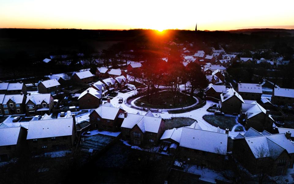 Homes in the village of Keele, Staffordshire, were covered in snow on Monday morning as the week ahead is expected to bring more snow (REUTERS)