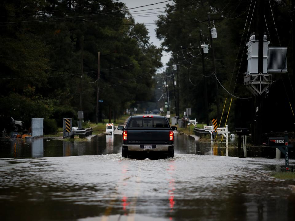 Hurricane delta flooding louisiana car street baker