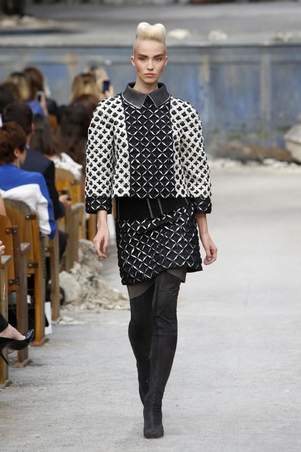 A model wears a creation by German fashion designer Karl Lagerfeld for Chanel's Haute Couture Fall-Winter 2013-2014 collection, presented Tuesday, July 2, 2013 in Paris. (AP Photo/Francois Mori)