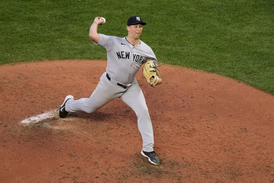 New York Yankees starting pitcher Cody Poteet throws during the fifth inning of a baseball game against the Kansas City Royals Wednesday, June 12, 2024, in Kansas City, Mo. (AP Photo/Charlie Riedel)