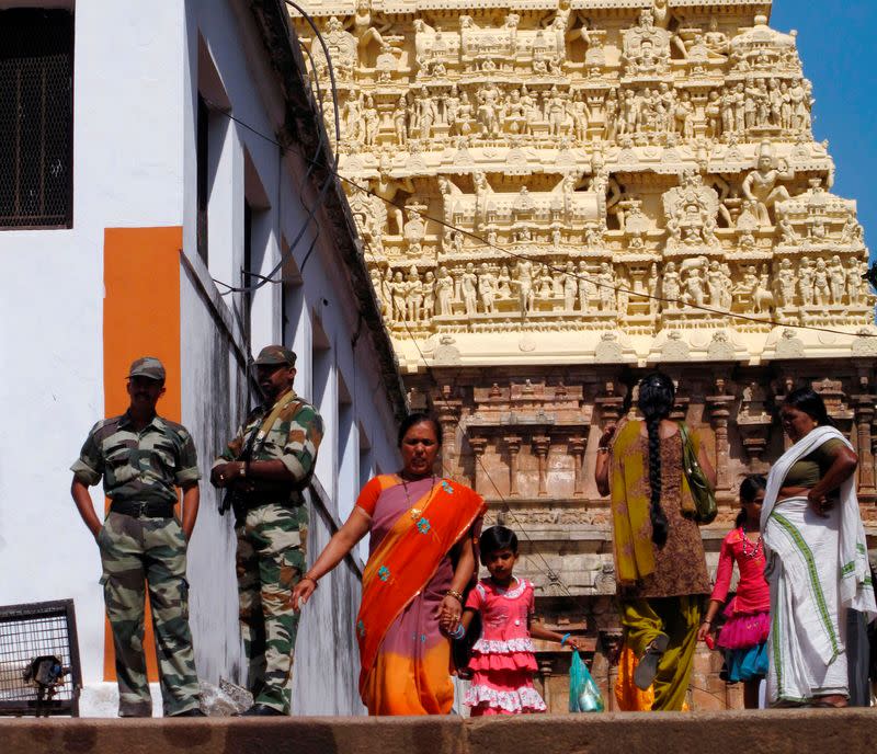 FILE PHOTO: Hindu devotees visit the Sree Padmanabhaswamy temple in Kerala state, southern India