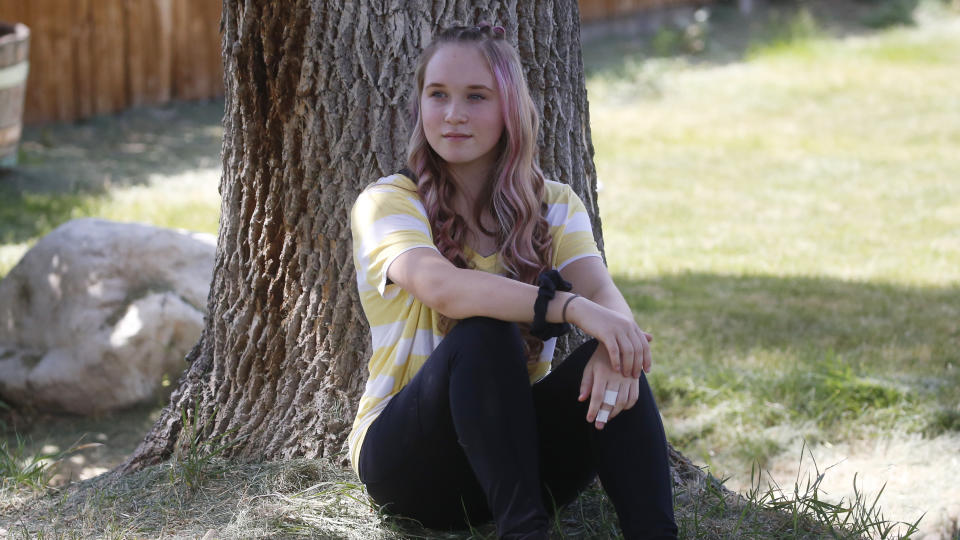 High school student Brianne Harmon is shown Monday, Aug. 10, 2020, in Magna, Utah. Harmon, 16, struggled at the end of last school year as she tried to find a quiet place to work in a remote school in a house with several relatives. She was in danger of failing three classes but after a series of sleepless nights, she managed to catch up, allowing her to continue with the drill team, a sport she loves. (AP Photo/Rick Bowmer)