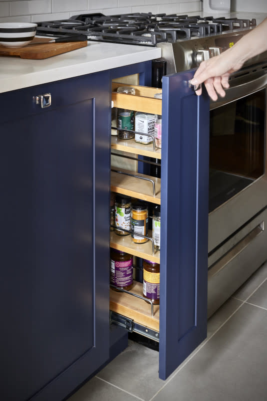 Use space-saving cabinetry for canned goods and spices.<p>Block Renovation</p>
