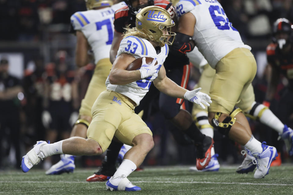 UCLA running back Carson Steele (33) rushes against Oregon State during the second half of an NCAA college football game Saturday, Oct. 14, 2023, in Corvallis, Ore. (AP Photo/Amanda Loman)