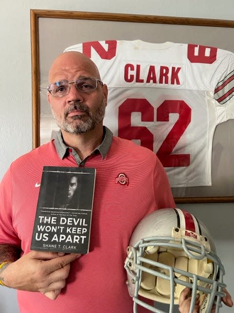 Former Ohio State nose guard Shane Clark's first novel, "The Devil Can't Keep Us Apart" was published in April.