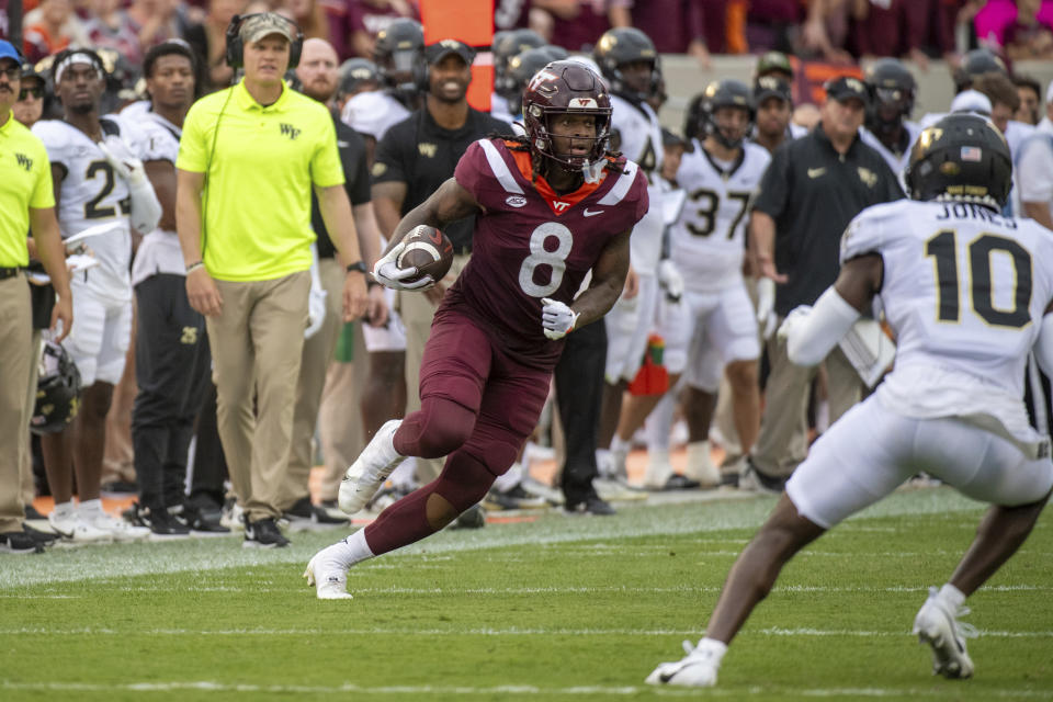 Virginia Tech's Dae'Quan Wright (8) runs with the ball against Wake Forest during the first half of an NCAA college football game, Saturday, Oct. 14, 2023, in Blacksburg, Va. (AP Photo/Robert Simmons)