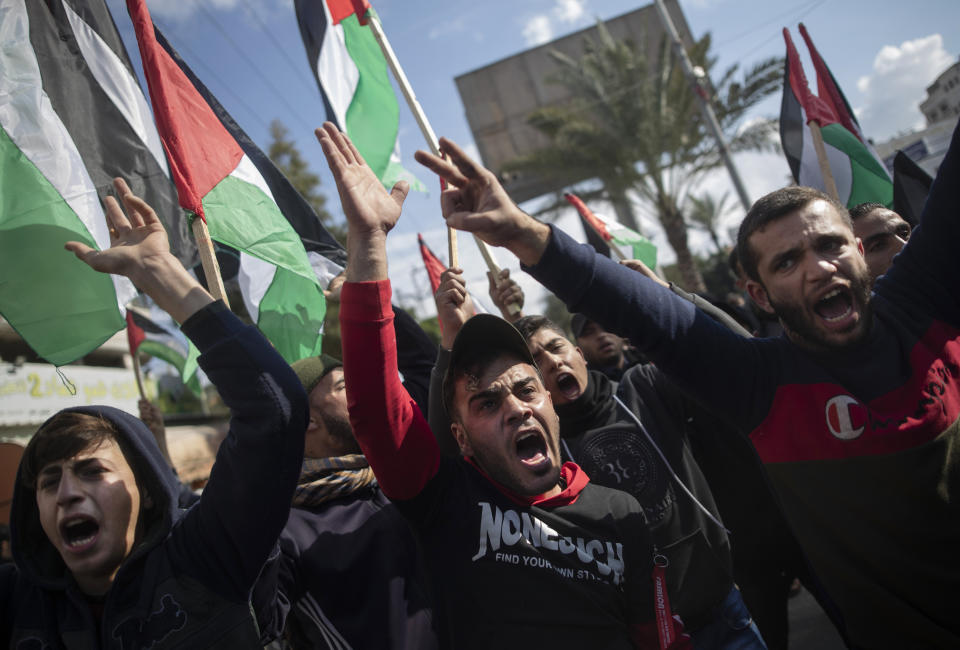 Palestinian protesters chant angry slogans during a protest against the U.S. Mideast peace plan, in Gaza City, Monday, Jan. 28, 2020. U.S. President Donald Trump is set to unveil his administration's much-anticipated Mideast peace plan in the latest U.S. venture to resolve the Israeli-Palestinian conflict. (AP Photo/Khalil Hamra)