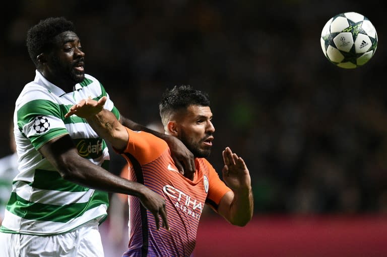 Celtic's Kolo Toure (L) vies with Manchester City's Sergio Aguero during the UEFA Champions League Group C match