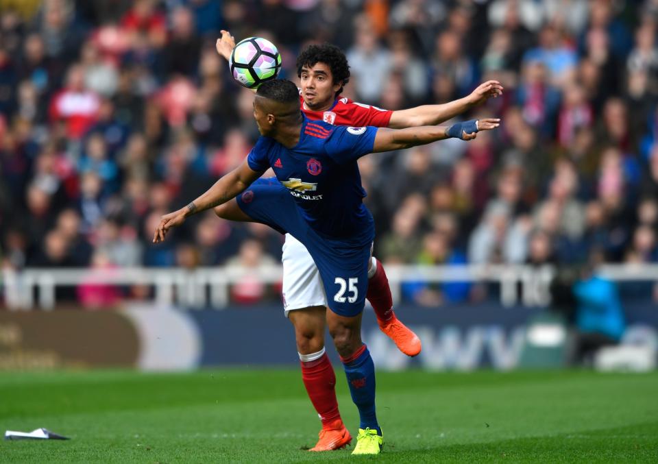 <p>Valencia and Fabio battle for the ball </p>