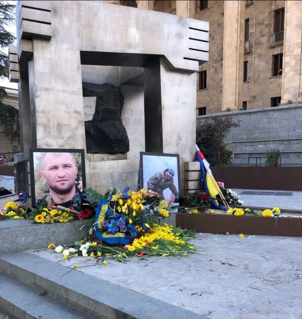 A makeshift memorial for Georgian fighters killed in Ukraine in front of the Georgian parliament building on March 25, 2022. (Nate Ostiller/The Kyiv Independent)