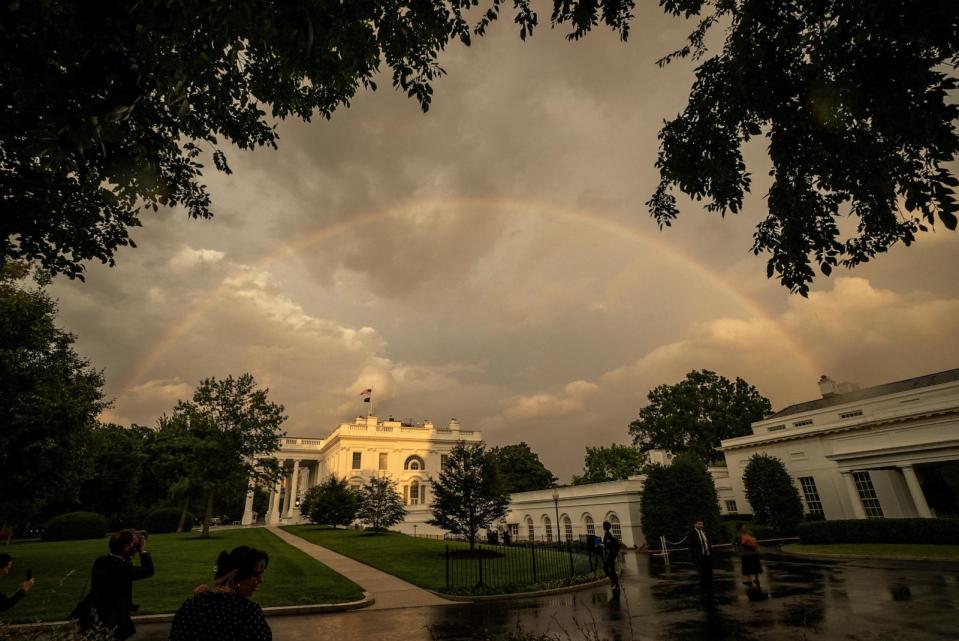 PHOTO: A rainbow fills the sky behind the White House right after U.S. President Joe Biden and first lady Jill Biden greeted NATO allies and partners ahead of a dinner at the White House in Washington, U.S., July 10, 2024. (Ken Cedeno/Reuters)