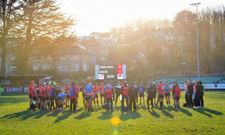 The Cornish Pirates gather to celebrate in the Penzance sun following their victory against Saracens at Mennaye Field.