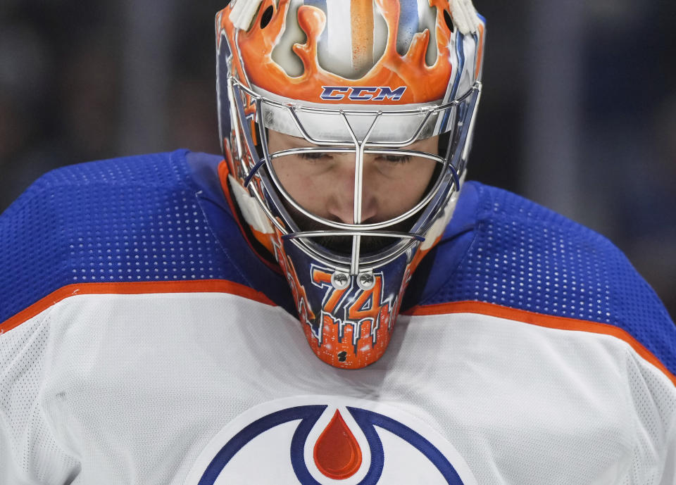 Edmonton Oilers goalie Stuart Skinner skates to the corner during a stoppage in play during the second period of an NHL hockey game against the Vancouver Canucks in Vancouver, British Columbia, on Monday, Nov. 6, 2023. (Darryl Dyck/The Canadian Press via AP)