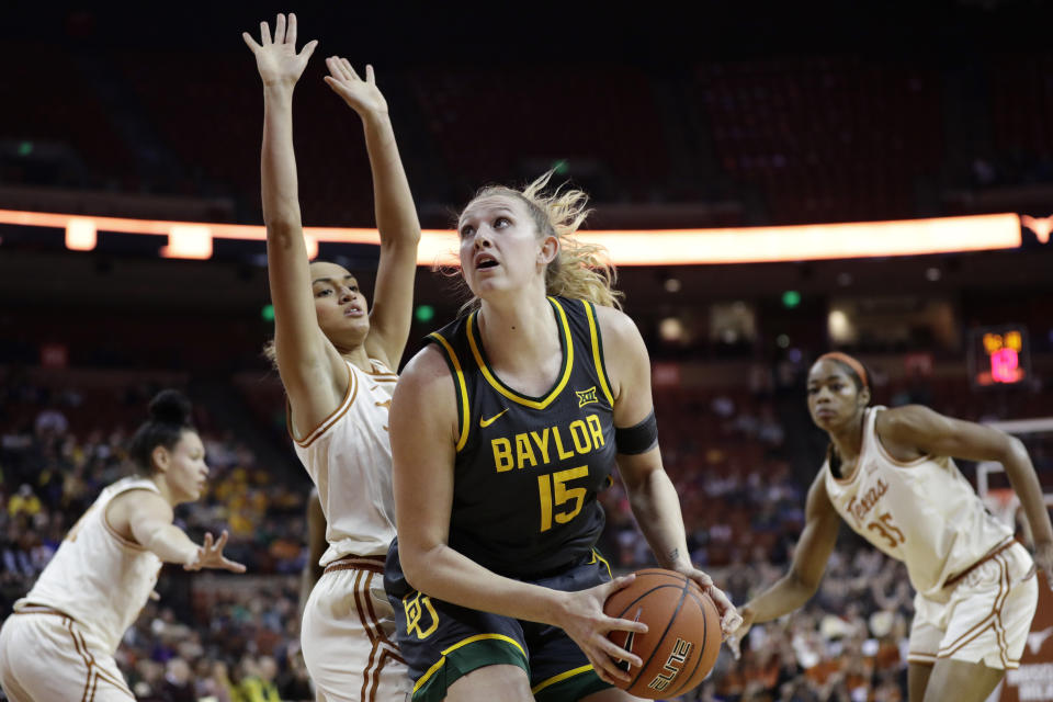 Baylor forward Lauren Cox (15) looks to shoot past Texas guard Celeste Taylor during the first half of an NCAA college basketball game Friday, Jan. 31, 2020, in Austin, Texas. (AP Photo/Eric Gay)