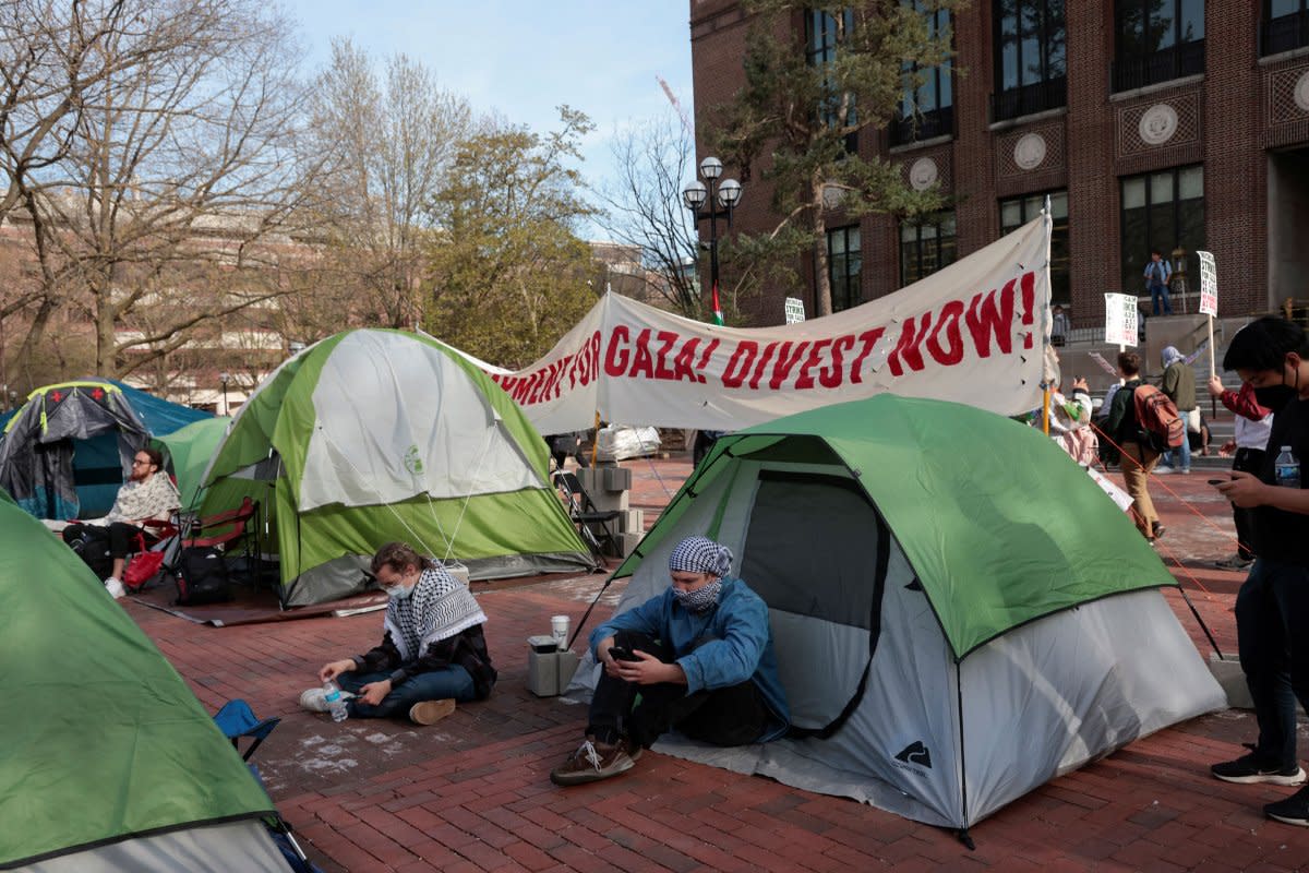 A coalition of University of Michigan students rally at an encampment to pressure the university to divest its endowment from companies that support Israel or could profit from the ongoing conflict between Israel and Hamas, on the University of Michigan college campus in Ann Arbor, Mich., on April 22, 2024.<span class="copyright">Rebecca Cook—Reuters</span>