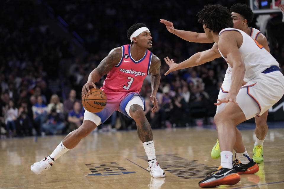 Washington Wizards guard Bradley Beal (3) drives against New York Knicks guard Quentin Grimes, back right, and center Jericho Sims during the second half of an NBA basketball game Wednesday, Jan. 18, 2023, at Madison Square Garden in New York. The Wizards won 116-105. (AP Photo/Mary Altaffer)