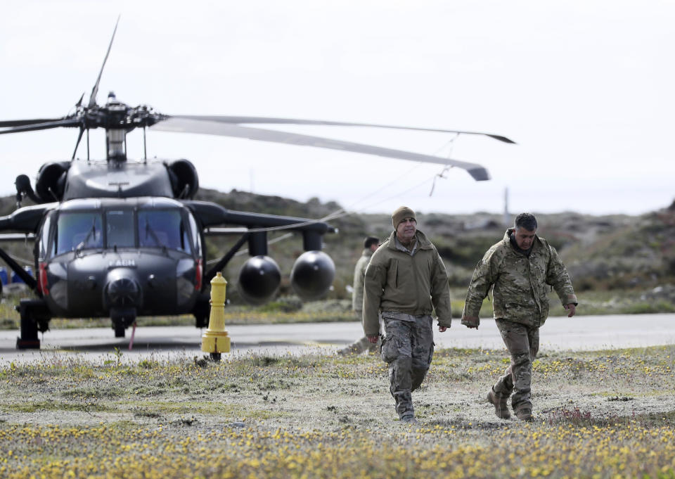 A Chilean army rescue team prepares prior their departure to search for a missing C-130 Hercules transport plane, at the air base in Punta Arenas, Chile, Wednesday, Dec. 11, 2019. Searchers using planes, ships and satellites were combing the Drake Passage on Tuesday, hunting for the plane carrying 38 people that vanished en route to an Antartica base. (AP Photo/Fernando Llano)