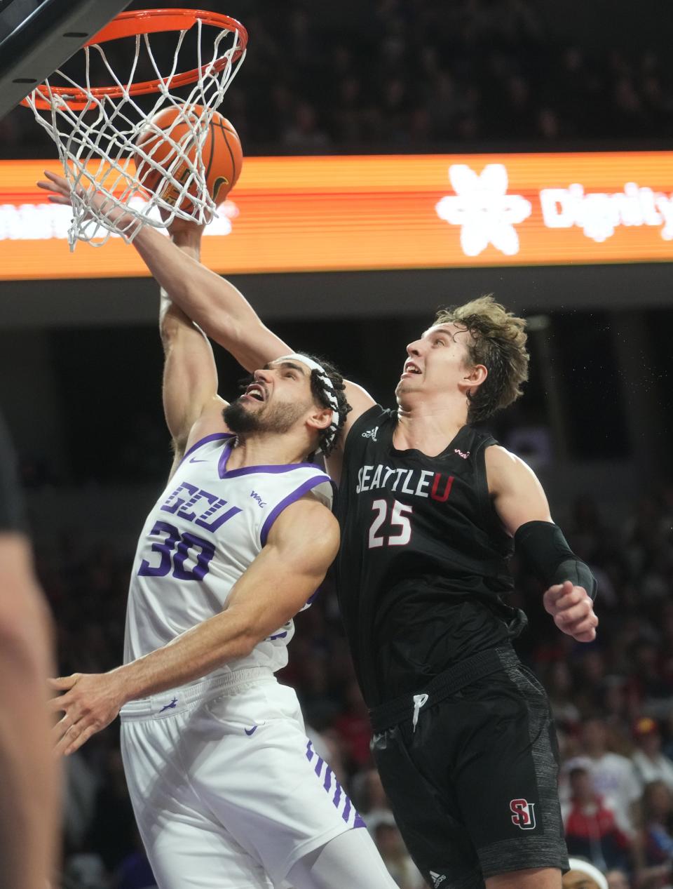 GCU Lopes forward Gabe McGlothan (30) attempts a shot while Seattle University Redhawks forward Brandton Chatfield (25) defends at GCU Arena in Phoenix on Feb. 1, 2024.